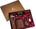 Everyday carry essentials for men laid out including watch, wallet, and keys